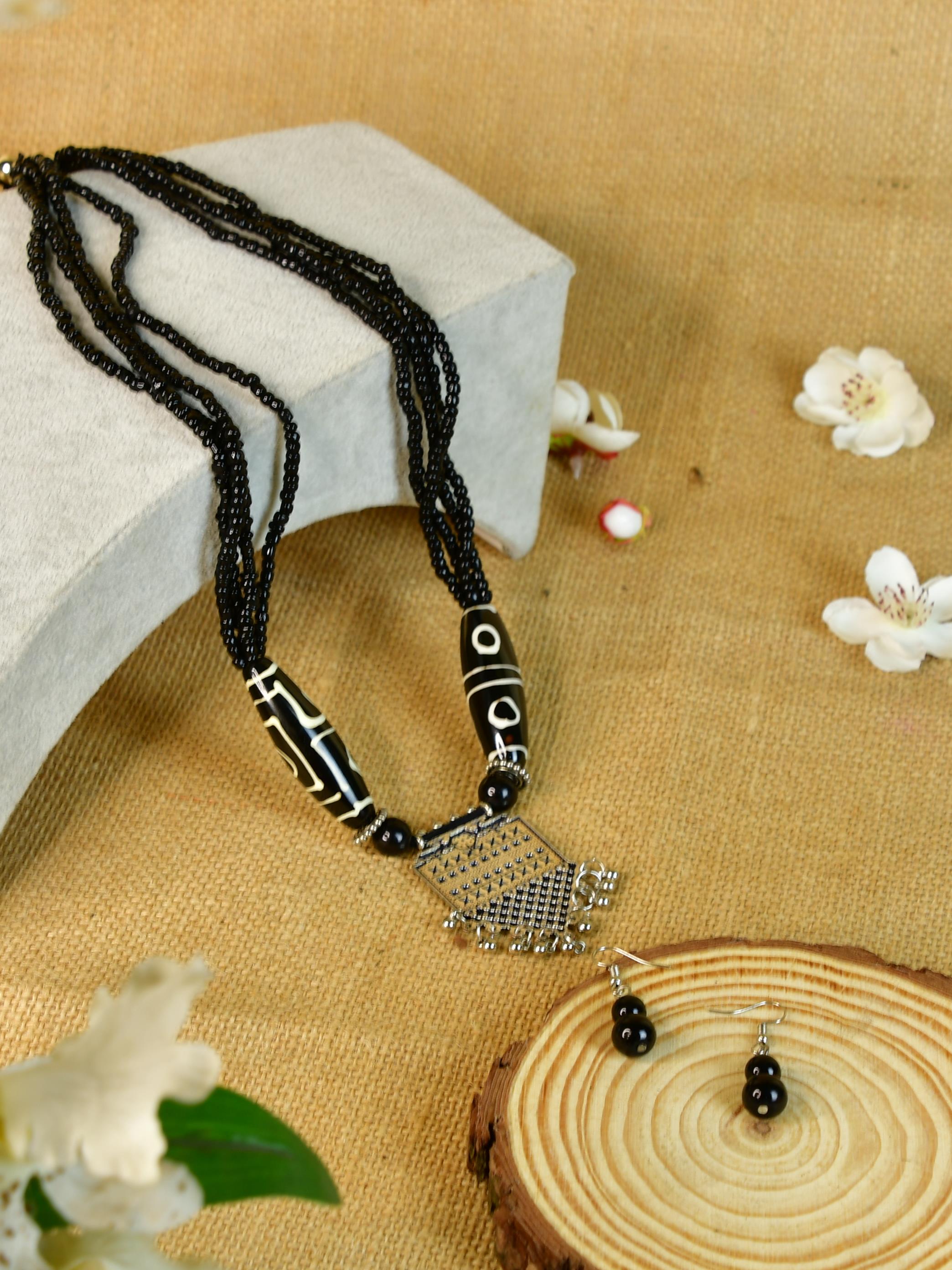 Sowpeace Handcrafted German Silver Necklace: Black Beads & Dzi Pendant